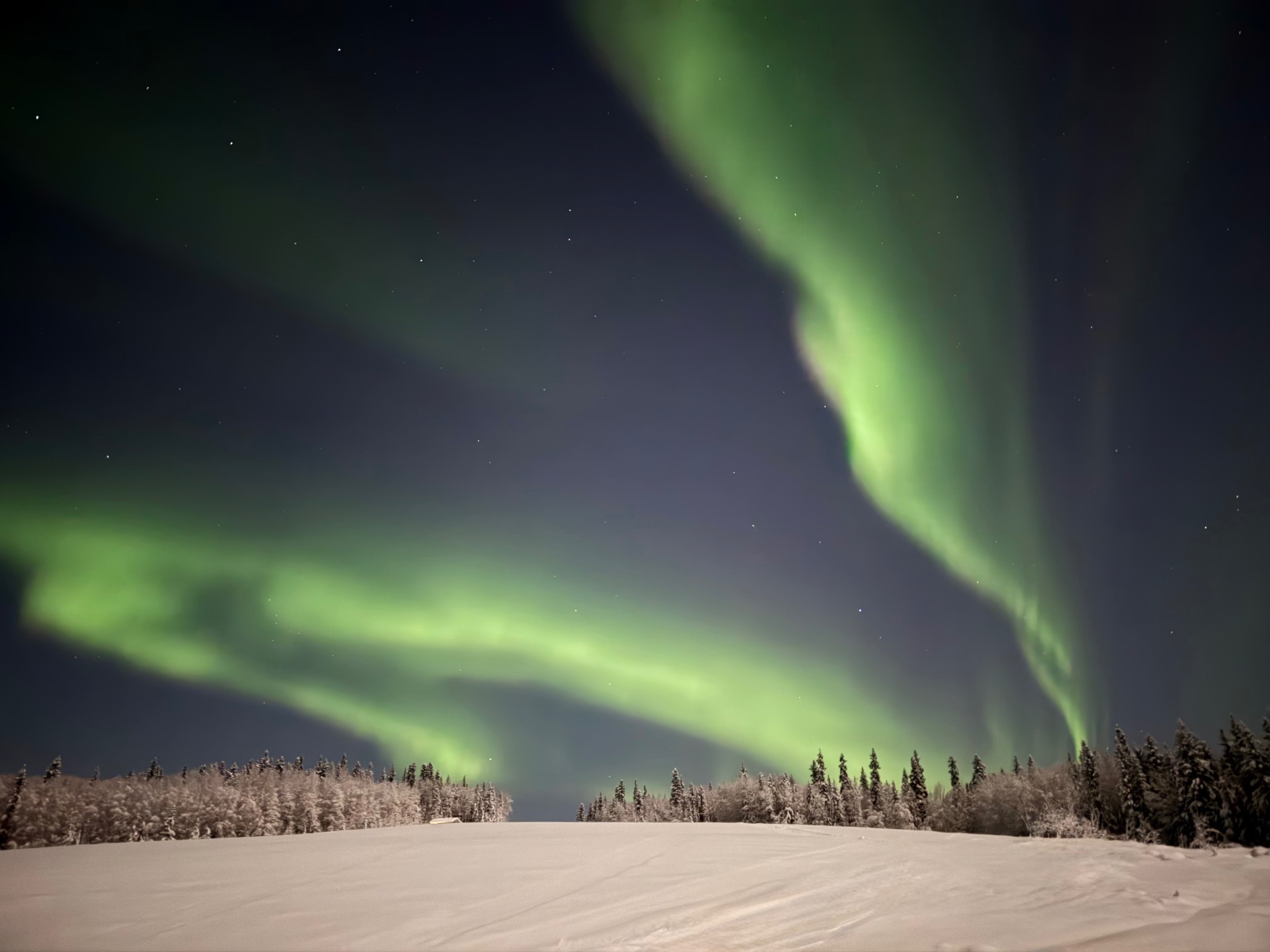 Aurora light over a still lake — a symbol of illumination